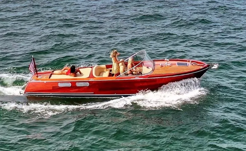Slide: The Image of Custom 2020 Windlea Runabout boat cruising on open water with passengers. - 1