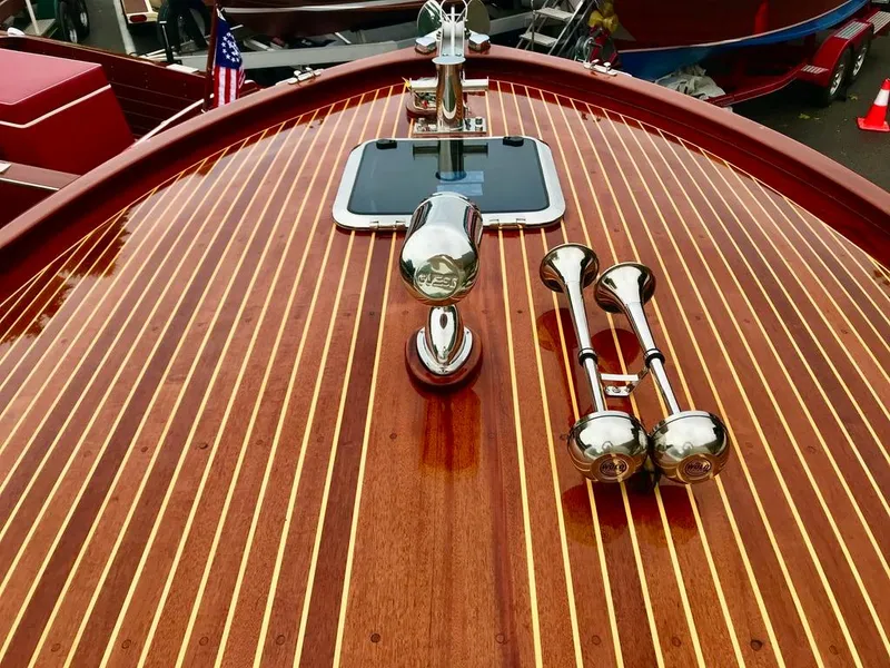 Slide: The Image of Custom 2020 Windlea Runabout boat with polished wood deck and chrome accents. - 14