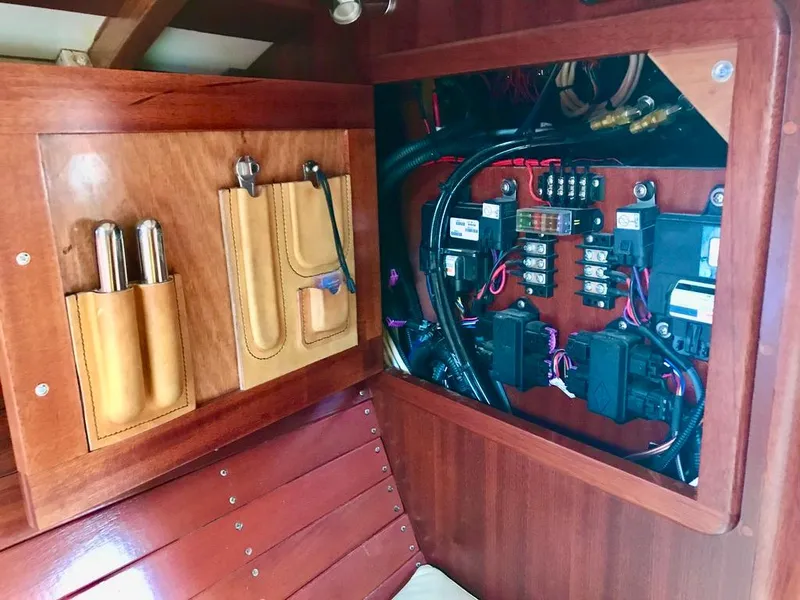 Slide: The Image of Electrical panel inside 2020 Custom Windlea Runabout, featuring organized wiring and tool storage. - 22