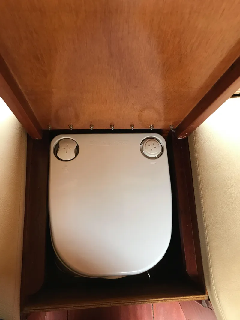 Slide: The Image of 2020 Custom Windlea Runabout interior with compact toilet design. - 23