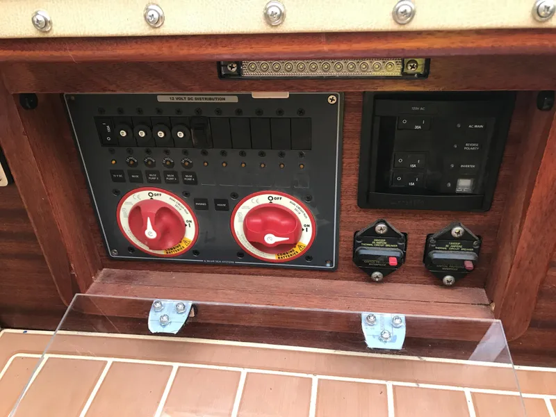 Slide: The Image of Control panel of a 2020 Custom Windlea Runabout boat with switches and dials. - 24