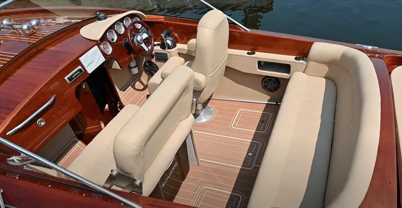 Slide: The Image of Luxurious 2020 Custom Windlea Runabout boat interior with beige seating and polished wood finish. - 25