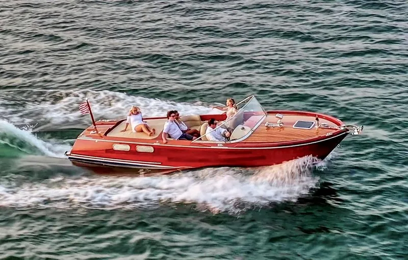 Slide: The Image of Custom 2020 Windlea Runabout boat cruising on open water with passengers enjoying the ride. - 3