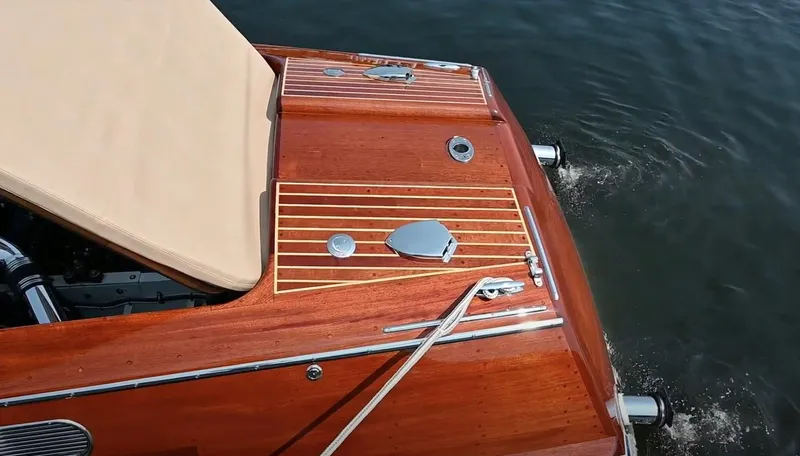 Slide: The Image of Custom 2020 Windlea Runabout boat with polished wood deck on water. - 32
