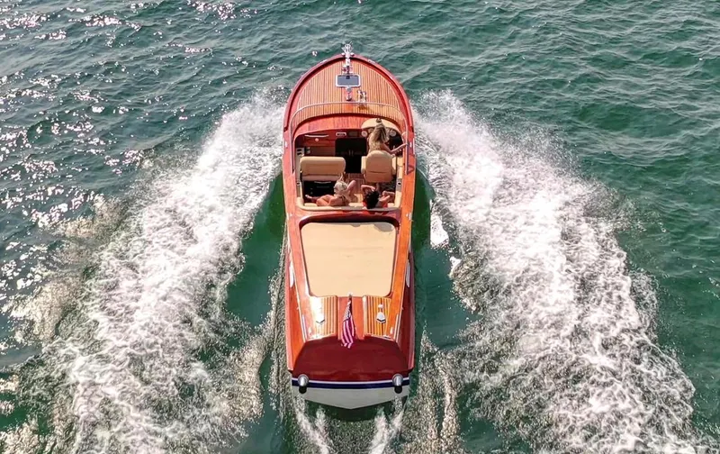 Slide: The Image of Custom 2020 Windlea Runabout boat cruising on open water, viewed from above. - 6