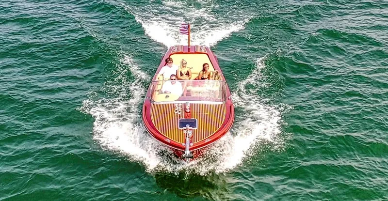 Slide: The Image of Custom 2020 Windlea Runabout boat cruising on open water with passengers onboard. - 7