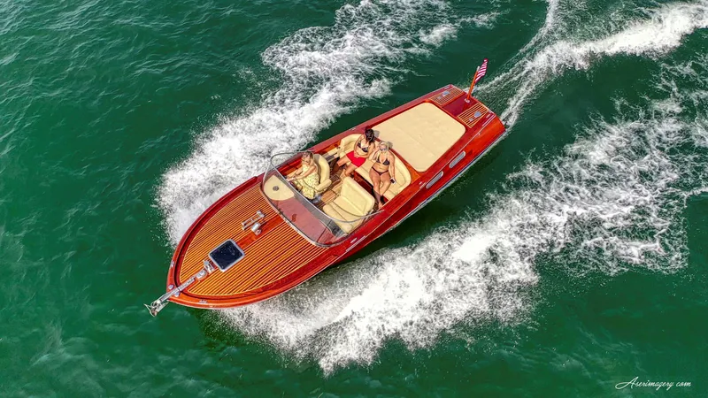 Slide: The Image of Aerial view of 2020 Custom Windlea Runabout boat cruising on clear water. - 9
