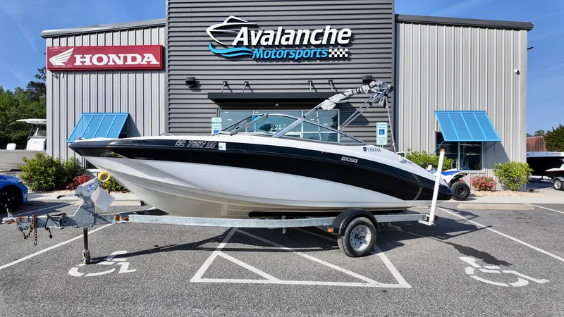 The Image of 2015 Yamaha SX190 boat on trailer at Avalanche Motorsports dealership. - 1