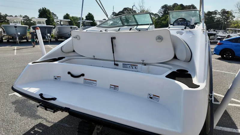 Slide: The Image of 2015 Yamaha Boats SX190, rear view, showcasing spacious swim platform and seating area. - 5