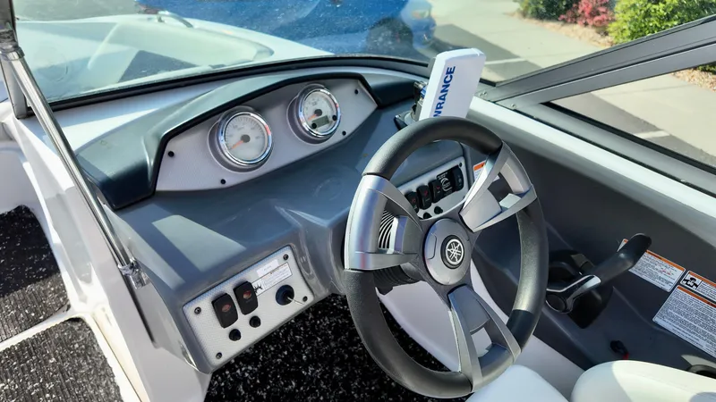 Slide: The Image of 2015 Yamaha Boats SX190 dashboard with steering wheel and gauges. - 8