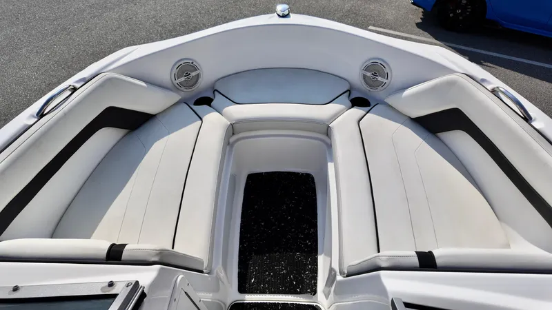 Slide: The Image of 2015 Yamaha Boats SX190 interior with white seating and speakers. - 9