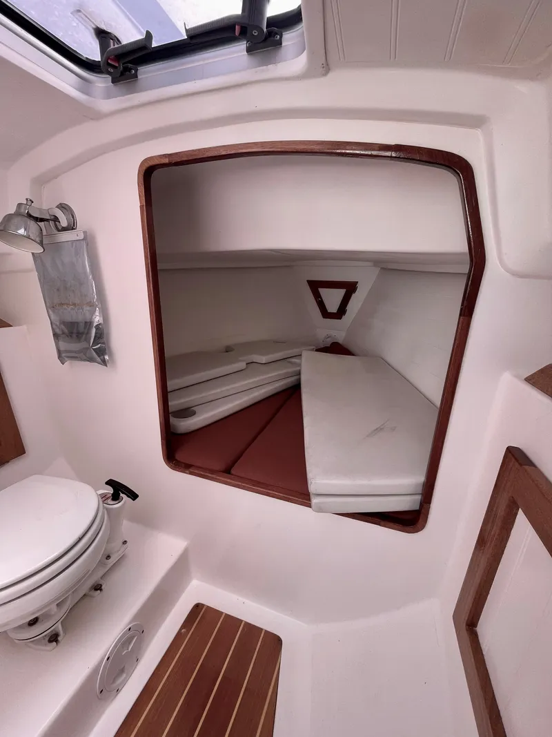 Slide: The Image of Interior cabin of a 2008 Schock Harbor 25 sailboat with a compact toilet. - 11