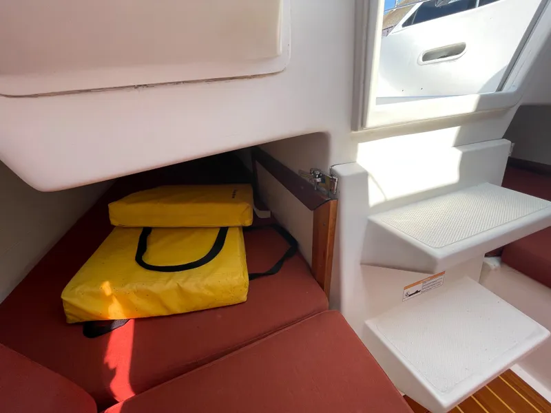 Slide: The Image of Interior of a 2008 Schock Harbor 25 sailboat with yellow life jackets. - 14