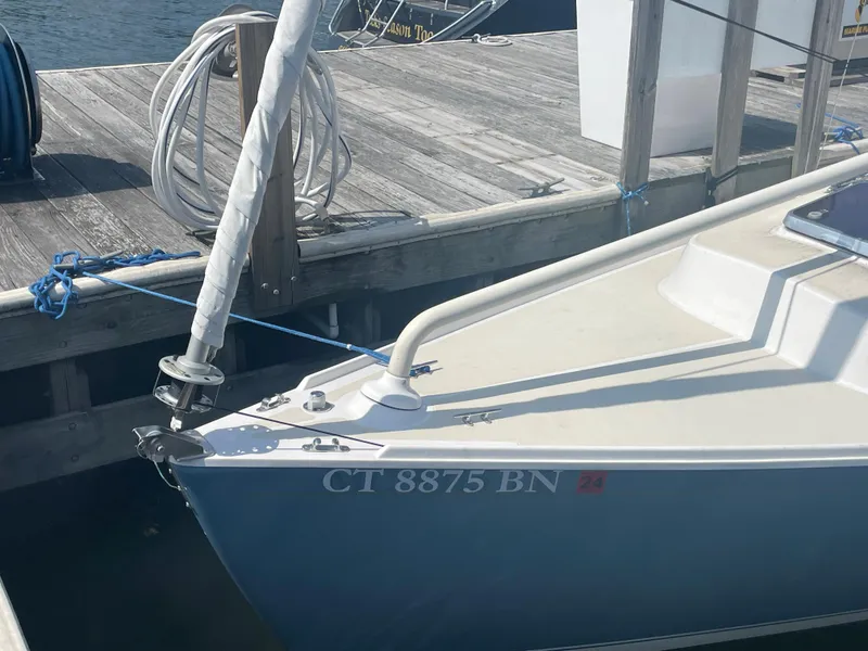 Slide: The Image of 2008 Schock Harbor 25 sailboat docked, showing bow and registration number CT 8875 BN. - 3