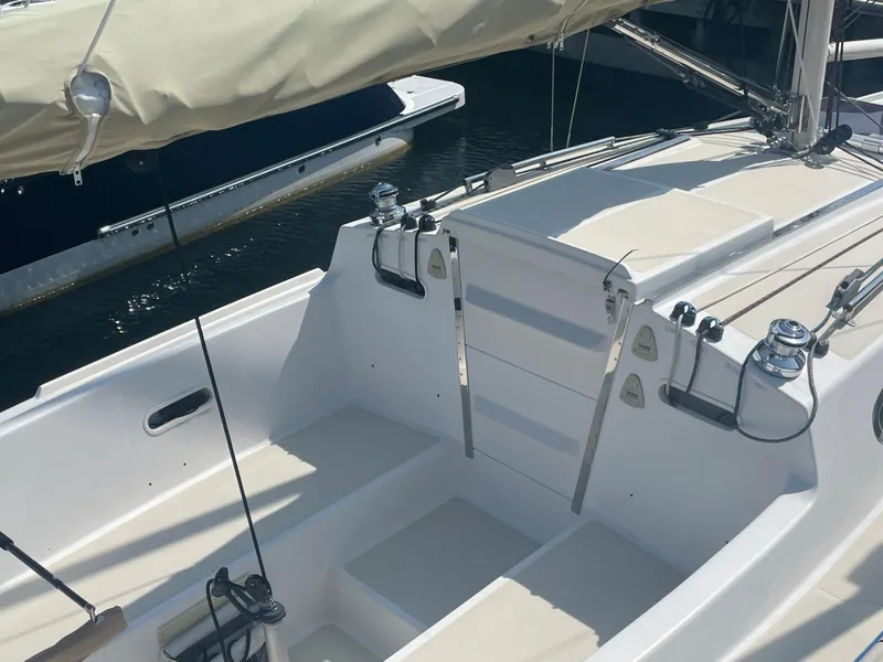 Slide: The Image of 2008 Schock Harbor 25 sailboat cockpit with white seating and rigging. - 7