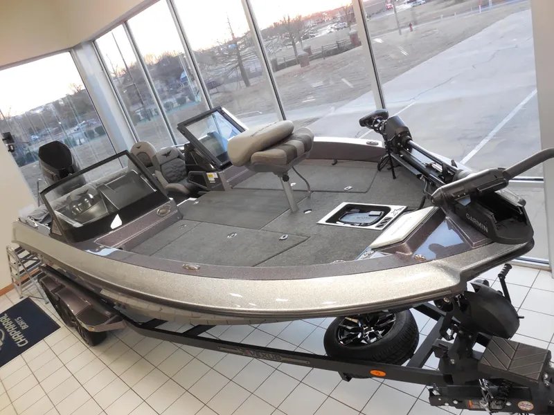 Slide: The Image of 2025 Vexus DVX 22 S fishing boat displayed indoors, showcasing sleek design and spacious deck. - 3