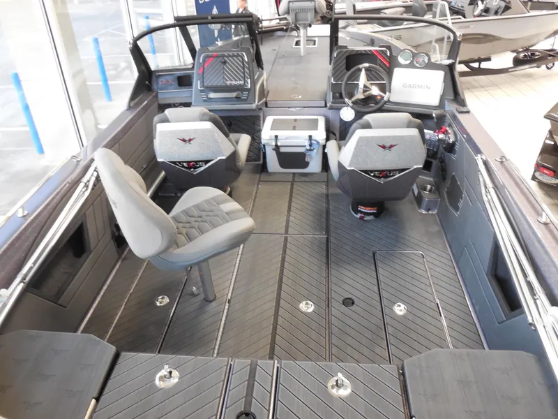 Slide: The Image of 2025 Vexus DVX 22 S boat interior with modern seating and dashboard controls. - 4