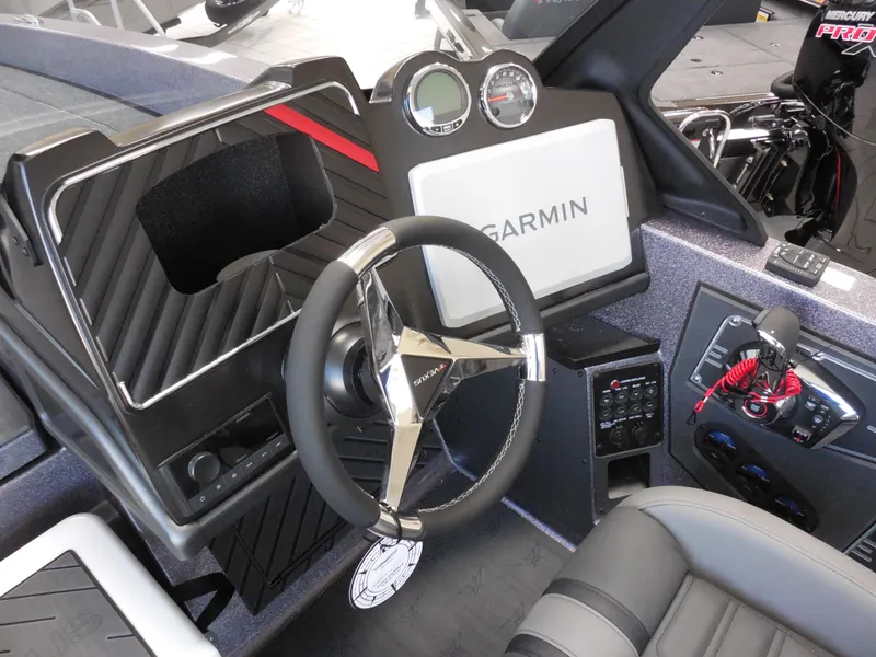 Slide: The Image of 2025 Vexus DVX 22 S boat dashboard with Garmin display and modern steering wheel. - 5