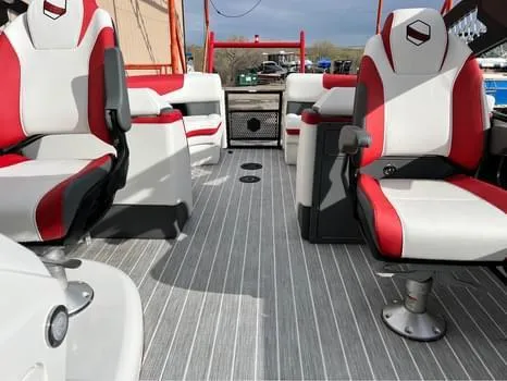 Slide: The Image of Interior of 2023 South Bay 525 RS Arch 3.0+ pontoon boat with red and white seating. - 11