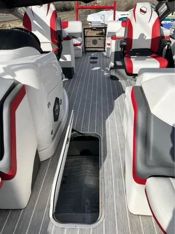Slide: The Image of 2023 South Bay 525 RS Arch 3.0+ interior with red and gray seating. - 13