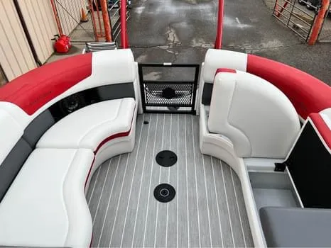 Slide: The Image of 2023 South Bay 525 RS Arch 3.0+ boat interior with red and white seating. - 8