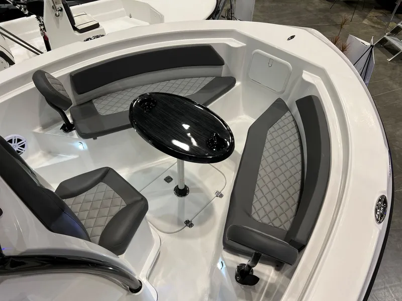 Slide: The Image of 2024 Polar 220 boat interior with seating and table. - 11
