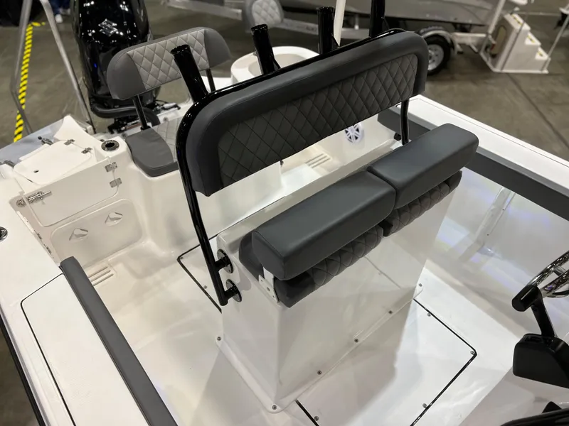 Slide: The Image of 2024 Polar 220 boat interior with cushioned seating and steering console. - 12