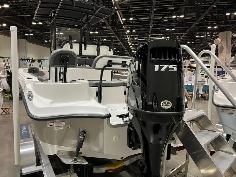 Slide: The Image of 2024 Polar 220 boat with 175 HP Suzuki outboard motor at a boat show. - 16