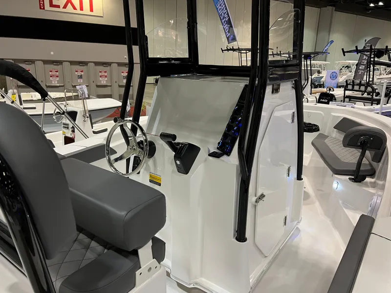 Slide: The Image of 2024 Polar 220 boat interior with steering wheel and seating. - 3