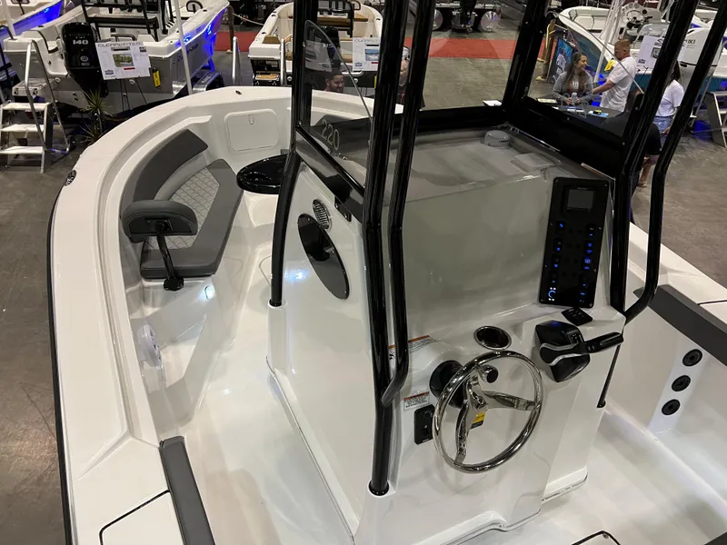 Slide: The Image of 2024 Polar 220 boat interior with steering console and seating. - 4