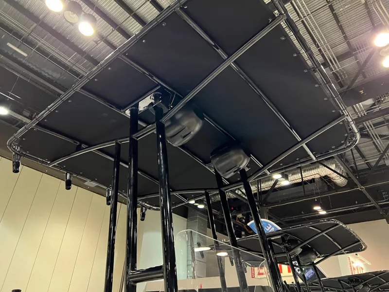 Slide: The Image of 2024 Clearwater 1900 boat with T-top at indoor exhibition. - 11