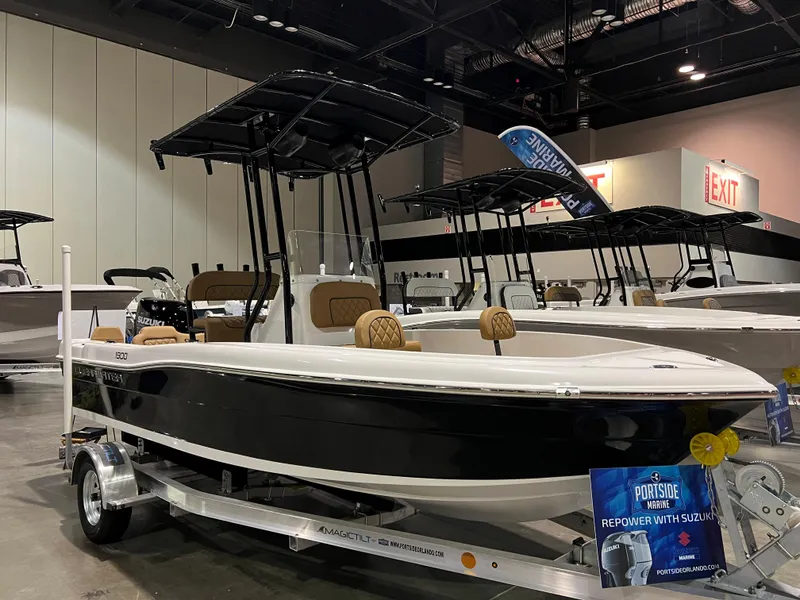 Slide: The Image of 2024 Clearwater 1900 boat on display at an indoor boat show. - 14