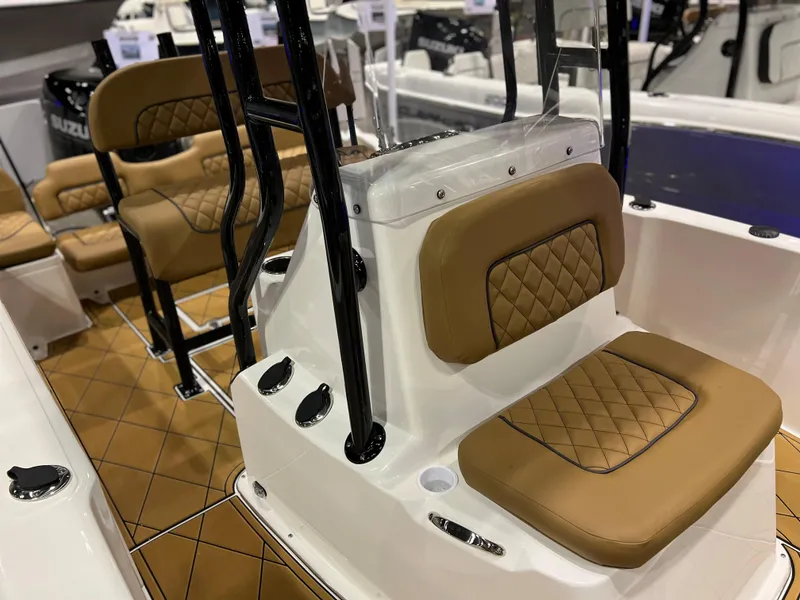 Slide: The Image of Clearwater 1900 2024 model boat interior with tan diamond-stitched seats. - 16