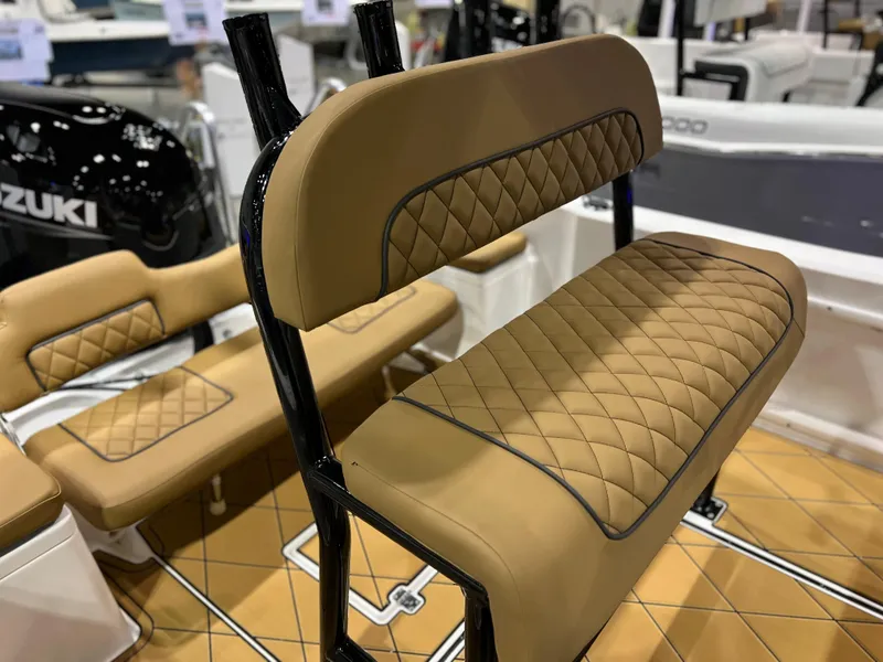 Slide: The Image of Clearwater 1900 2024 boat with tan diamond-stitched seats and Suzuki engine. - 18