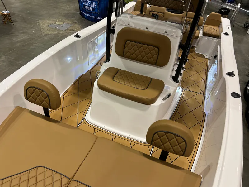 Slide: The Image of 2024 Clearwater 1900 boat interior with tan diamond-stitched seats and white hull. - 6