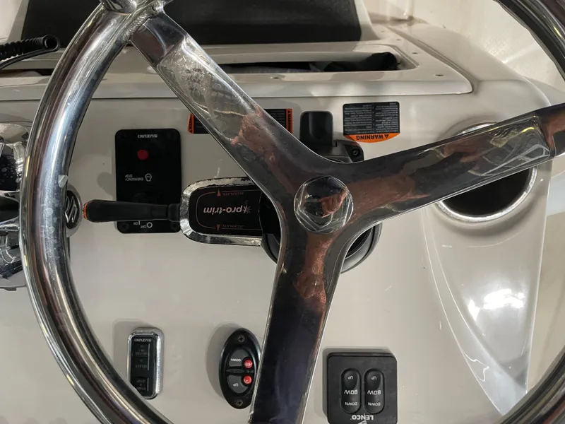 Slide: The Image of 2018 Blue Wave Center Console Hybrid boat steering wheel and control panel. - 21