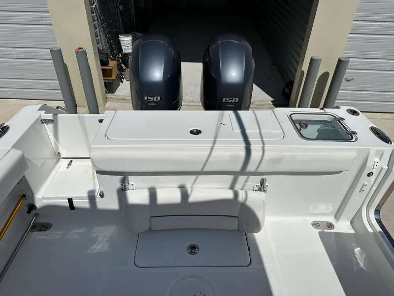 Slide: The Image of 2018 Sea Hunt GAMEFISH 27 CB boat with twin 150 HP engines, rear deck view. - 6