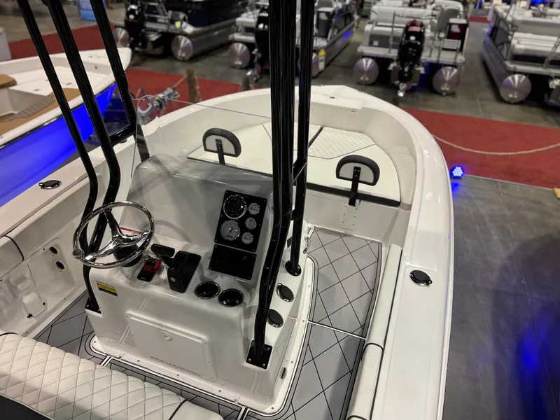 Slide: The Image of 2024 Clearwater 2000 boat interior with control console and seating. - 11