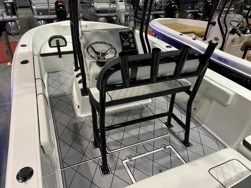 Slide: The Image of 2024 Clearwater 2000 boat interior with steering console and seating. - 21