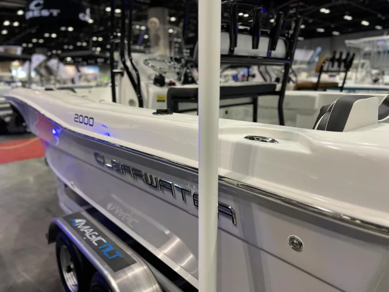 Slide: The Image of 2024 Clearwater 2000 boat on display at a boat show. - 24