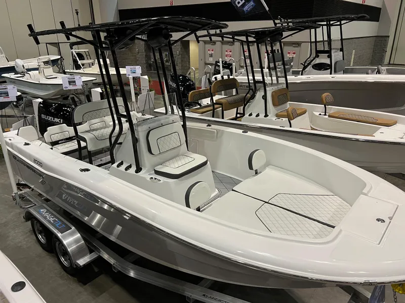 Slide: The Image of 2024 Clearwater 2000 boat on display at a showroom. - 3