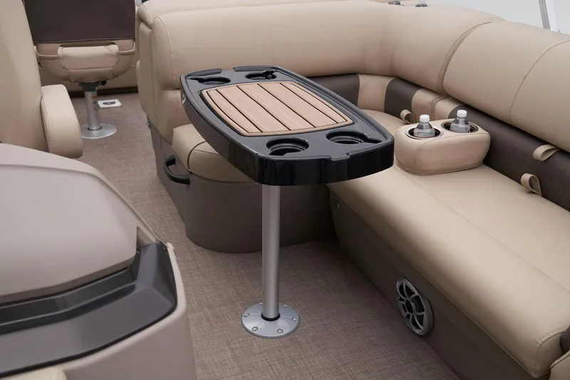 Slide: The Image of Interior of 2024 Sun Tracker Fishin' Barge 22 XP3 with beige seating and table. - 46