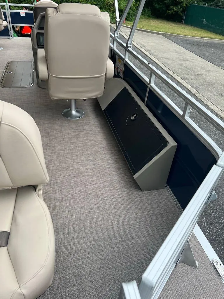 Slide: The Image of 2024 Sun Tracker Fishin' Barge 22 XP3 interior seating and deck view. - 6