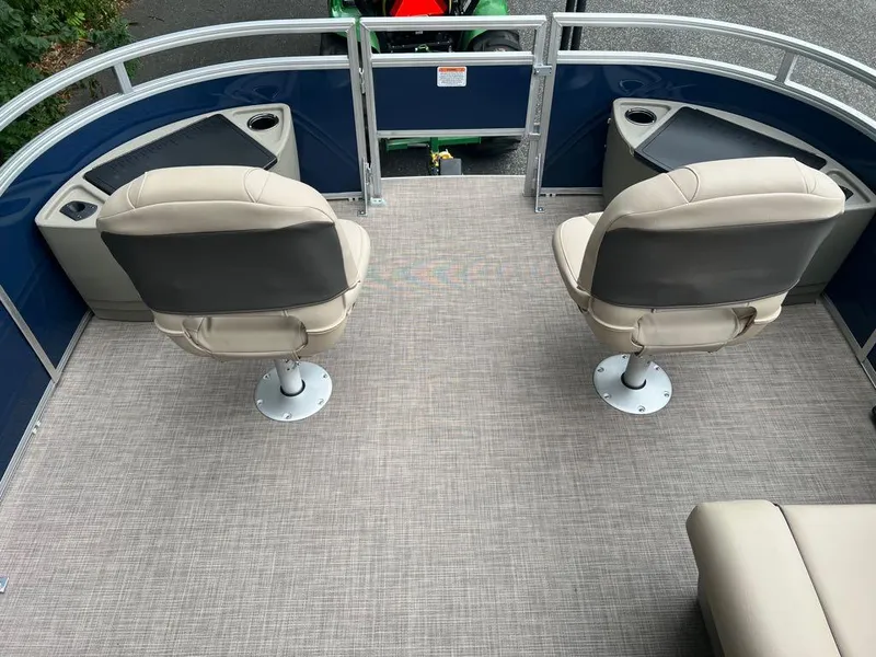 Slide: The Image of 2024 Sun Tracker Fishin' Barge 22 XP3 boat with two swivel seats and cup holders. - 9