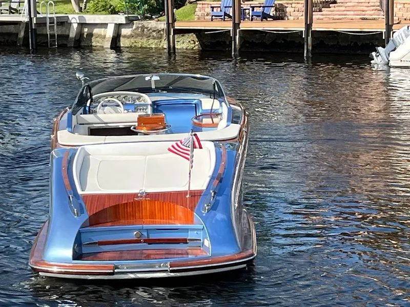 Slide: The Image of 2012 Riva Aquariva Super luxury boat docked on calm water. - 3