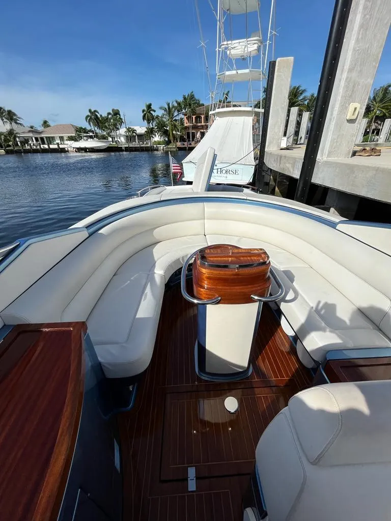 Slide: The Image of 2012 Riva Aquariva Super luxury boat with elegant seating and wooden deck. - 7