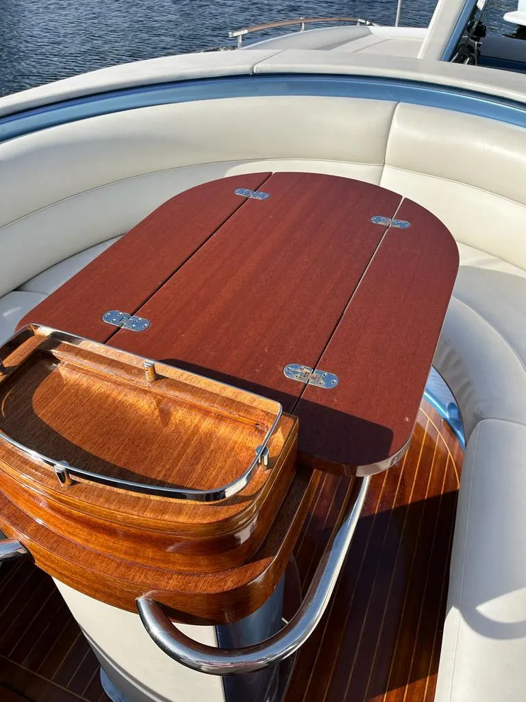 Slide: The Image of Luxurious wooden table on a 2012 Riva Aquariva Super yacht. - 8