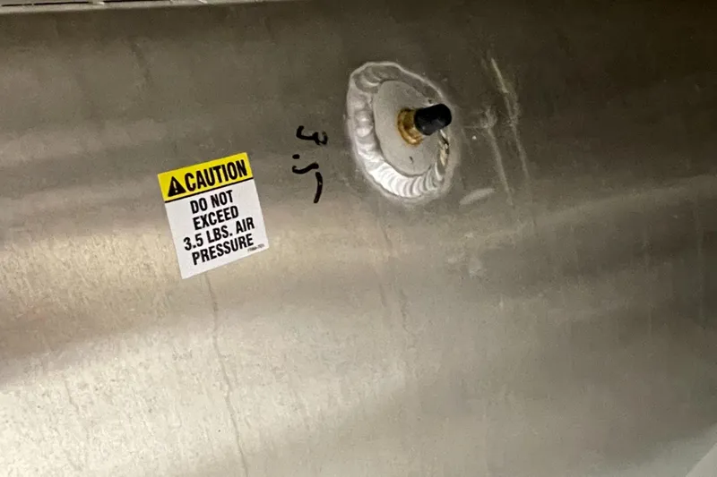 Slide: The Image of Caution label on 2023 Berkshire 22 RFX CTS pontoon, air pressure warning. - 13