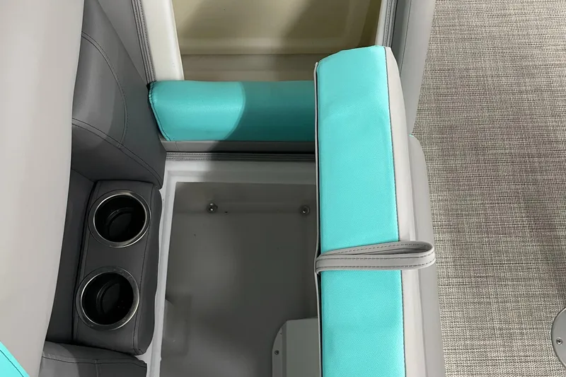 Slide: The Image of 2023 Berkshire 22 RFX CTS boat interior with teal and gray seating and cup holders. - 3