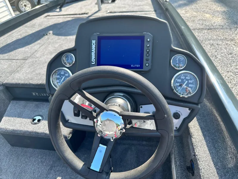 Slide: The Image of 2024 Ranger RT198P boat dashboard with Lowrance Elite fishfinder and steering wheel. - 5